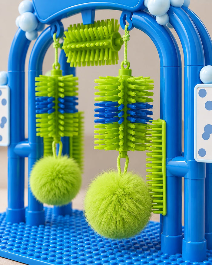 Close-up of the green bristle brushes and a pom-pom